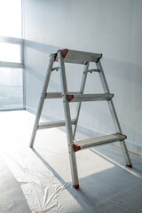 Stepladder standing in the room to renovate.