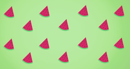 Composition of rows of watermelon slices on green background
