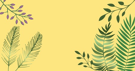 Composition of exotic leaves forming frame with copy space on yellow background