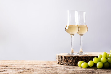 Italian golden grappa drink on wooden background. Copy space