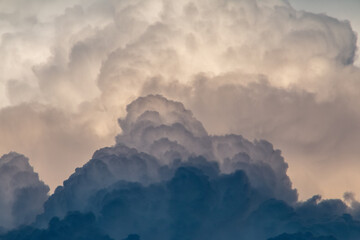fluffy stormy clouds in the sunset sky
