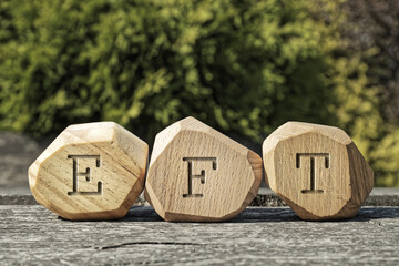 Letters EFT written on wooden blocks. Emotion-focused therapy treatment concept.