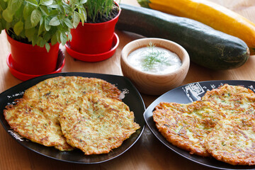 Zucchini pancakes with yoghurt-herb dip