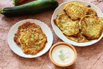 Zucchini pancakes with yoghurt-herb dip