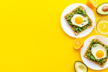 Sandwich with eggs avocado cream and spinach, top view
