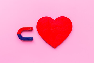 Horseshoe magnet with heart shapes. Love and dating concept