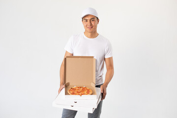 Asian delivery man in white cap and t-shirt holds boxes of pizza. Mock-up.
