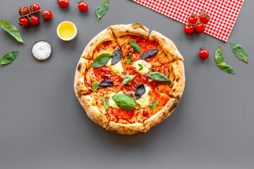 Food ingredients for cooking pizza - tomatoes cheese and basil