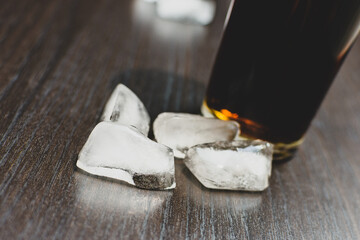 dark carbonated drink in a glass with ice