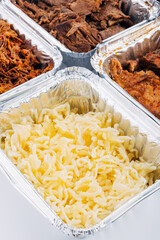 Yellow cheese is used to fill the arepas