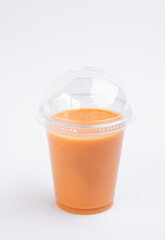 Orange juice in transparent plastic glass. Take away. Healthy food concept. High quality photo