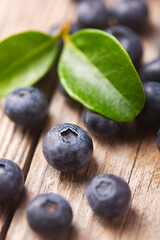 Organic blueberries close up on wooden background