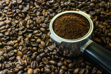 Coffee beans and coffee horn with ground coffee