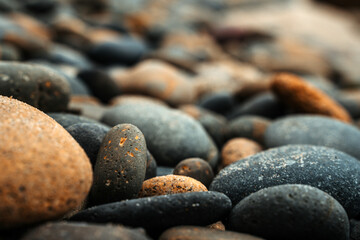 Fototapeta na wymiar Beautiful stones on the beach on the coast of California. Natural background