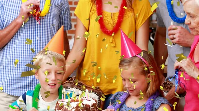Animation of confetti falling over happy family at birthday party