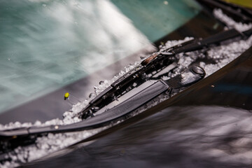 small hail ice balls on black car hood after heavy summer storm - obrazy, fototapety, plakaty