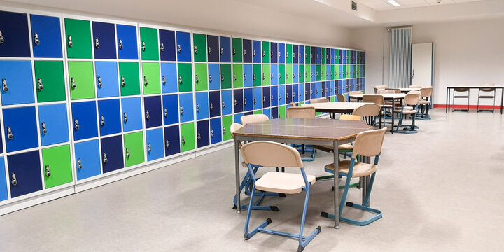 Empty Junior High Canteen,long Wall Closed Colorful School Lockers In Gymnasium,other Secondary Educational Institution,tables And Chairs Around In Cafeteria,selective Focus,copy Space,back To Concept