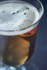 Glass of beer on dark background. Close up.	