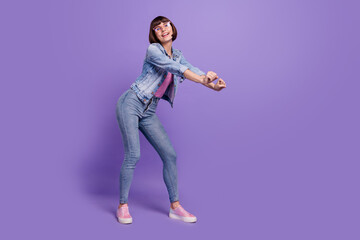 Full length photo of young brunette lady dance wear spectacles jeans shirt sneakers isolated on...