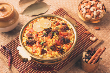 Beef Biryani Mutton biryani , Gosht or lamb biriyani Hyderabadi Dum biriyani with raita yoghurt dip special occasion Indian festival food Ramadan , Eid Hyderabad Kerala India Sri Lanka. Lankan food.	