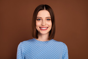 Fototapeta premium Photo of optimistic bob hairdo young lady wear blue shirt isolated on brown color background
