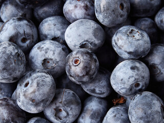 Blueberry fruit top view isolated on a white background, flat lay overhead layout with mint leaf, healthy design concept.