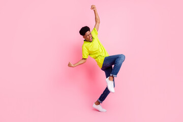 Full size profile side photo of young cheerful afro guy happy positive smile rejoice victory...