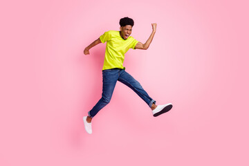Fototapeta na wymiar Full body photo of afro american young man jump up air winner good mood isolated on pink color background