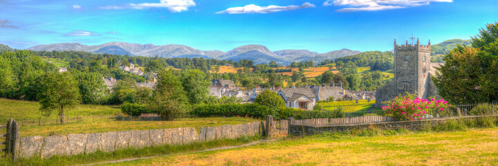 Hawkshead the Lake District Cumbria in summer with blue sky church and red roses in colourful HDR panoramic
