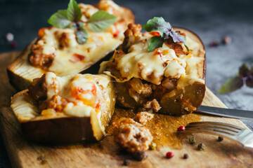Stuffed eggplant. Delicious hot dish. Eggplant with meat, cheese and herbs