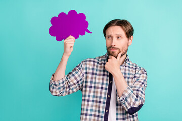 Photo of young man hand touch chin look paper bubble idea imagination plan isolated over teal color...