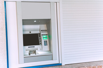 Mock Up, ATM machine in the city. against the background of white roller blinds.
