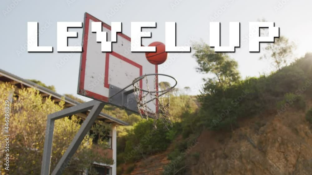 Poster animation of level up text over ball falling into backet