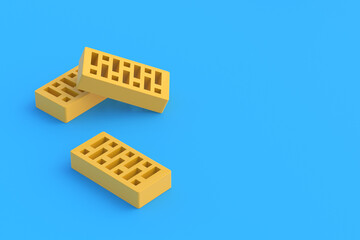 Perforated clay bricks on blue background. Home construction. Building renovation. Copy space. 3d render
