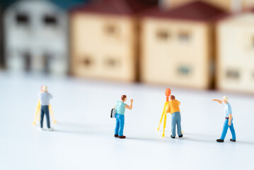 Miniature Inspector or Engineer Worker Labor is checking House building structure and Home Working...