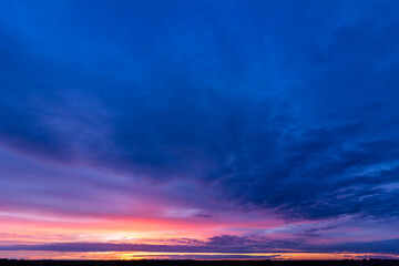 Fototapeta premium Colorful sunset with clouds in the evening