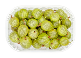 Green gooseberries in a wooden bowl. Fresh and ripe berries, fruits of Ribes, also known as European gooseberry, with sourish sweet taste. Close-up, from above, isolated over white, macro food photo. - obrazy, fototapety, plakaty