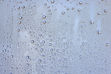 drops glass blue background abstract, transparent cold background water splashes