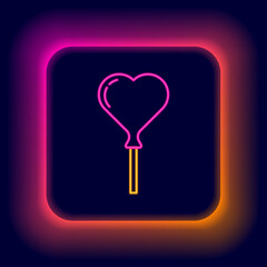 Glowing neon line Balloons in form of heart with ribbon icon isolated on black background. Colorful outline concept. Vector