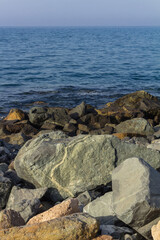 Rocky shoreline in warm sunlight