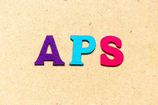Color cloth alphabet letter in word APS (Abbreviation of Account payable system or Advanced planning and scheduling) on wood background