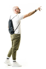 Stylish geek with pants tucked in socks reaching hand buying or taking copy space. Side view. Full length portrait isolated on white background