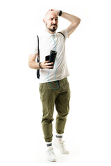 Funny confused lost tourist holding phone and water looking away scratching bald head.  Full length portrait isolated on white background