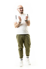 Excited cheerful nerdy style hipster geek man looking away applauding and celebrating. Full length...