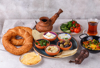 Traditional Turkish breakfast with meze and simit