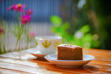 Coffee cake and hot coffee in the flower garden, refreshing in the morning