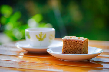 Coffee cake and hot coffee in the flower garden, refreshing in the morning