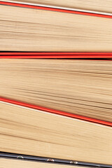 Different hardcover books in a row. Texture background.