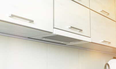 Cooker hood in modern kitchen interior, kitchen applicance concept background photo