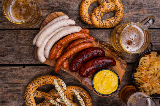 Oktoberfest dishes with beer, pretzel and sausage